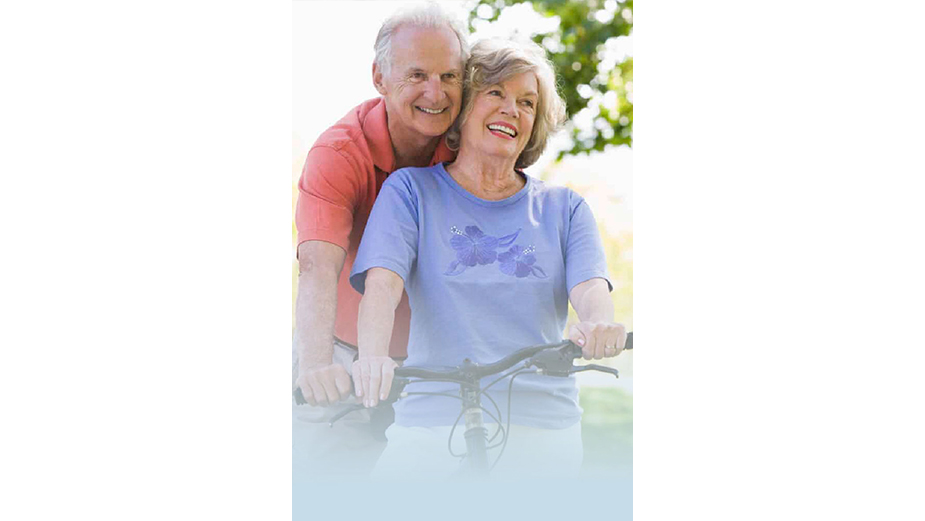 Older couple riding bicycle together