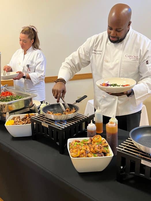 CareOne team member serving food
