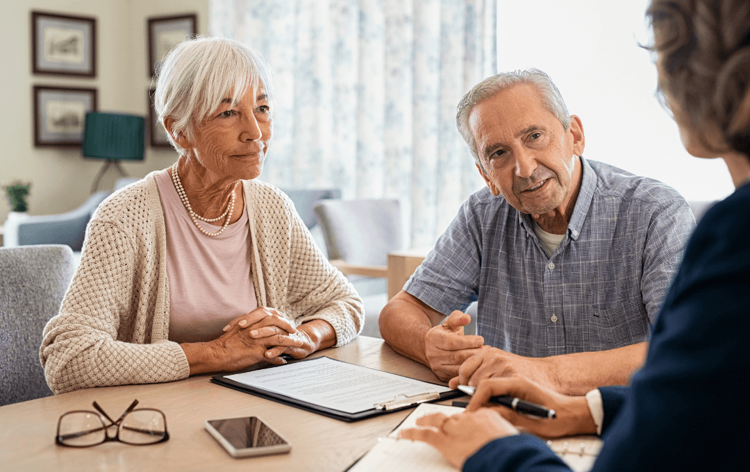 Woman and man discussion dementia care with a professional